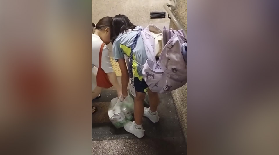 有片〡屯門10歲女童疑被逼拿兩袋啤酒 途人不忿：唔好咁對個女